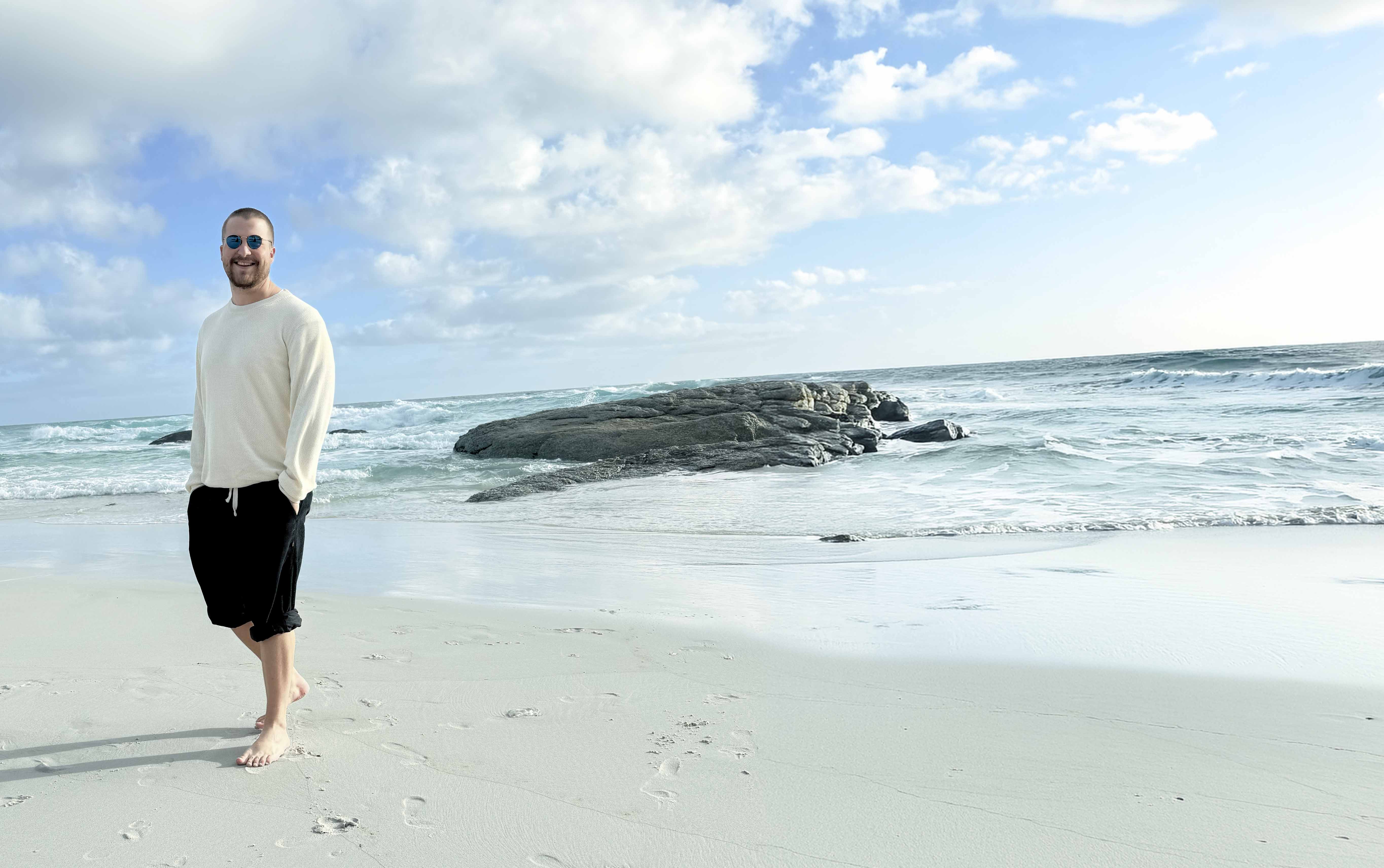 Trey Breytenbach walking on a beach